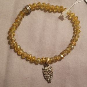 Amber beaded bracelet with owl charm